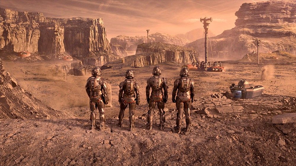 4 personnes portant des combinaisons sophistiquées regardent devant eux, sur la planète Mars.